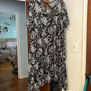 New black and white dress . Beautiful embroidery in white on a black background